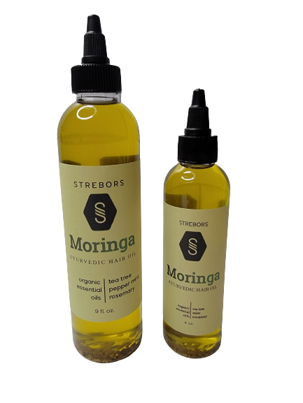 A bottle of Moringa Hair Oil