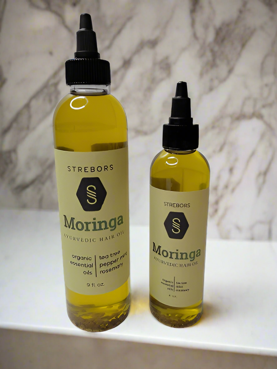 A bottle of Moringa Hair Oil