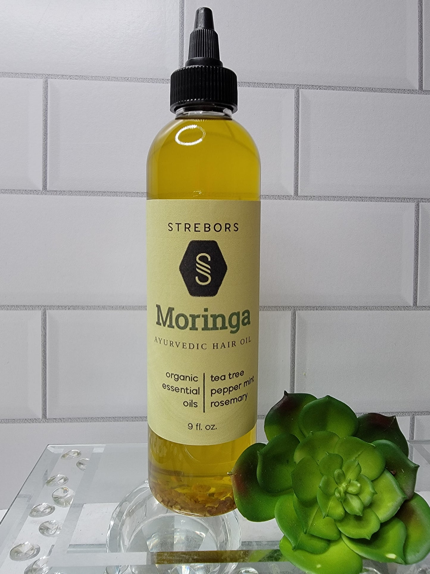9 oz bottle of Moringa Hair Oil