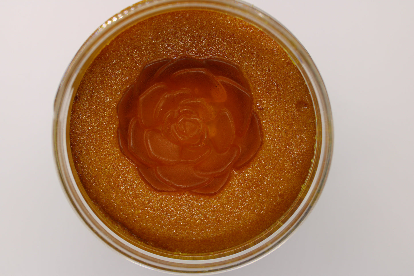 Open jar of Strebors Turmeric Ginger Scrub